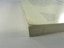Close view of wear and creasing at the lower corner of the rear cover and page block.