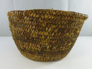 Another side view showing the woven plant-fiber construction and edge wear.