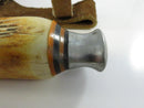 Close view of metal pommel and decorative handle spacers