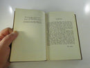 Interior view of the open hardcover showing the thick text block and commentary pages.
