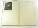 Close view of handwriting on the front endpaper, including a name, address, phone number, price, and page notes.