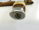 End view of metal pommel with visible slotted securing screw