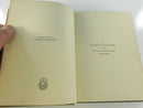 Open book showing aged blank endpaper and adjacent blank leaf