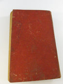 Decorative Gothic-style front endpapers with handwritten ownership writing at the top of the right page.