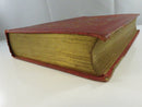 Front endpapers with foxing and a loose folded paper or tissue sheet at the front.