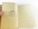 Macmillan publisher device and imprint page facing a blank endpaper.