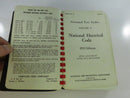 Open preliminary pages showing a Compson Code Company price sheet beside the National Fire Codes Volume V 1953 Edition title page.