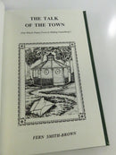 Illustrated interior title page for The Talk of the Town showing a small pavilion among trees, framed by an ornamental border.
