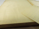 Close view of the rear endpaper area with a loose lined-paper insert.