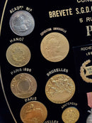 A. Massonnet (& Cie) Manufacture of Medals Exhibition Medal Advertising Display Case With Cast Medals product image for Just Stuff I Sell, clear front view, neutral background, original listing photo, optimized descriptive alt text, centered composition variant 11