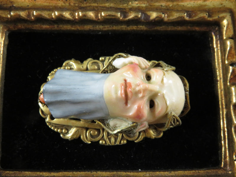 Vintique Hand Painted Porcelain Mask Pierced Gilded Metal Mount with Coral Cabochon