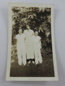 Woman & Sons Posing In Front of House Black & White Photograph 4 1/2" x 2 3/4" product image for Just Stuff I Sell, clear front view, neutral background, original listing photo, optimized descriptive alt text, centered composition
