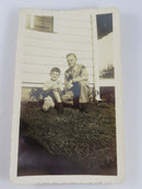 Little Boy Posing in With Father In Military Garb Circa 1940's 4 1/2" x 2 3/4" — front view