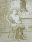 Little Tennis Girl with Tennis Racket& Ball in Front of Plants Antique Photograp — front view