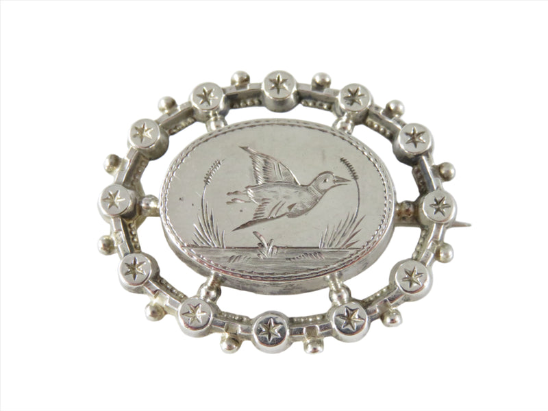 Victorian Aesthetic Movement Sterling Etched Bird Brooch with Starburst Surround