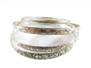 Beau, Danecraft Sterling Silver Bangle Collection of 4 Sterling Bangles — Bracelets • Sterling Silver, Silver — front view